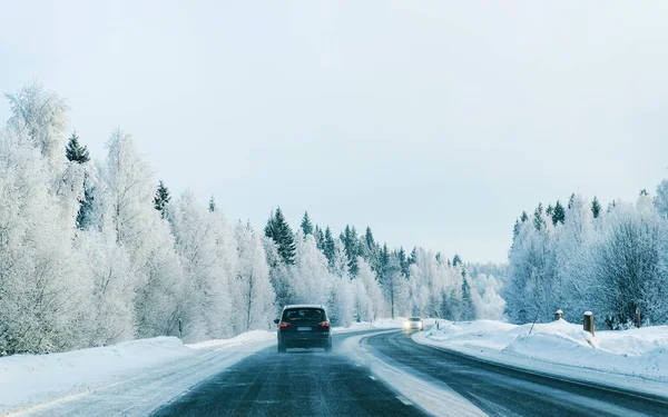 Landscape with car at road in snowy winter Lapland reflex — Stock Photo, Image