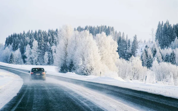 Car at a road a snowy winter Lapland reflex — Stock Photo, Image