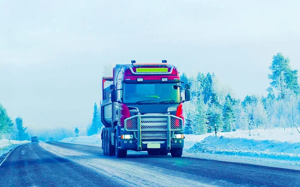 Truck at Snow Road at winter Finland Lapland reflex
