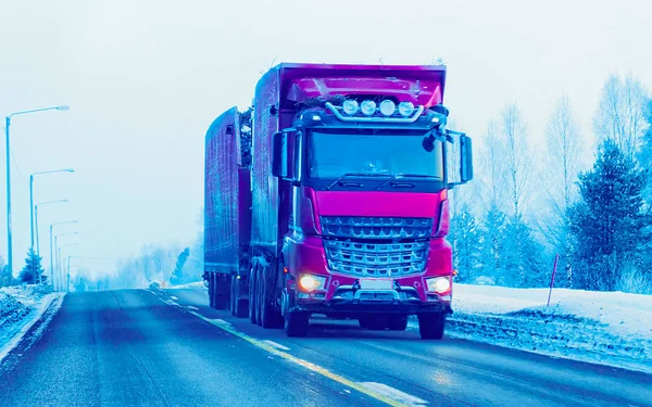 Truck in Snow Road in winter Lapland in Finland reflex