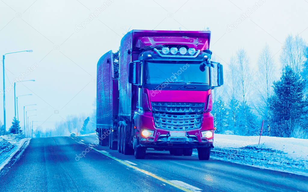 Truck in Snow Road in winter Lapland in Finland reflex