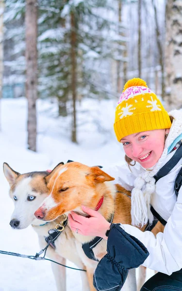 Girl and Husky dog in Rovaniemi Lapland of Finland reflex