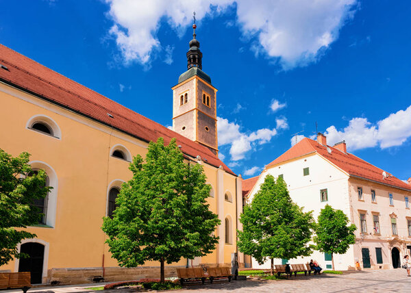 Street with Franciscan Church of St John the Baptist in Old city of Varazdin in Croatia. Panorama and Cityscape with Cathedral in Croatian town in Europe in summer