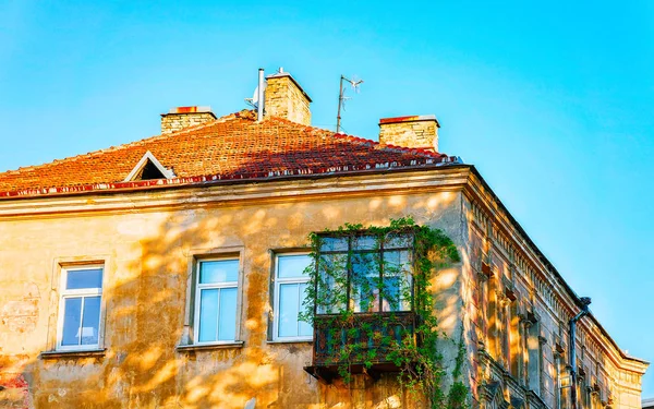 House with balcony in Old city center of Vilnius reflex