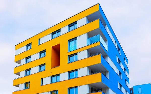 Blue yellow Modern residential apartment and flat building exterior Salzburg reflex