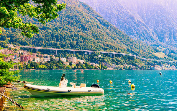 Montreux, Switzerland - August 28, 2016: Sail boat at Geneva Lake in Montreux, Vaud canton, Switzerland. Mixed media.