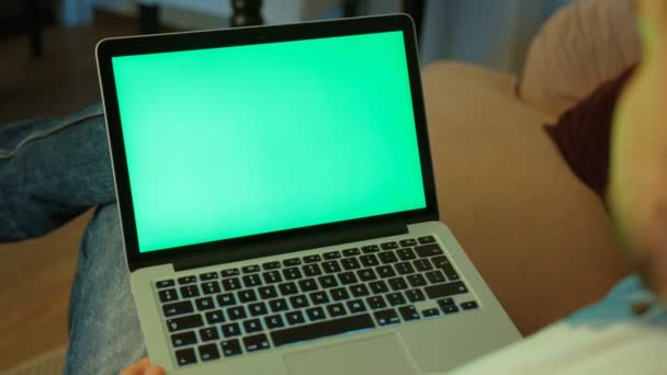 Young man hands using laptop for chatting with friend on brown wood background. Top view. Chroma key. — Stock Video