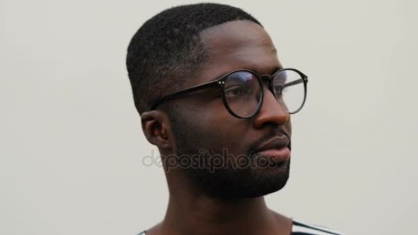 African man in striped shirt — Stock Video