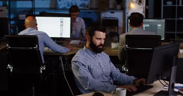 Businessmen and office workers gets excited by job done well on the computer and punches the air in late night. — Stock Video