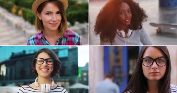 不同的多民族妇女在户外结成联盟，心情很好。漂亮的非洲裔美国女孩带着耳机对着摄像机笑。在街上戴着帽子的快乐的白人女性。城市里戴眼镜的女人 — 图库视频影像