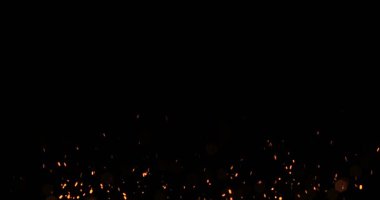 Altın Sim ışıltı parçacıklar altta siyah arka plan, parçacık alev ateş efekti başlatmak kabarcıklar