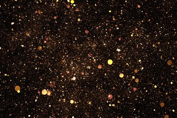 Zlatý třpyt sparkle bubliny částice na černém pozadí, slavnostní událost šťastný nový rok — Stock fotografie