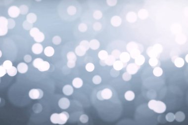 Noel Gümüş arka plan ile akan, bokeh şenlikli tatil mutlu yeni yıl