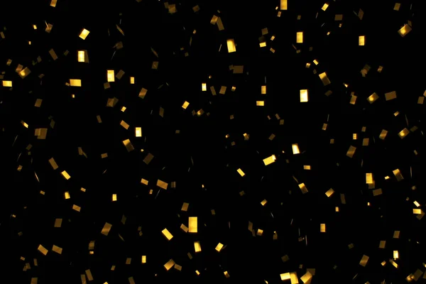 Spadające złoty brokat folia konfetti, na czarnym tle, wakacje i uroczysty zabawa — Zdjęcie stockowe