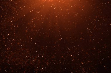 Altın glitter pırıltı parçacıklar bokeh siyah arka plan, olay festival üzerinde mutlu yeni yıl tatili kabarcıklar.