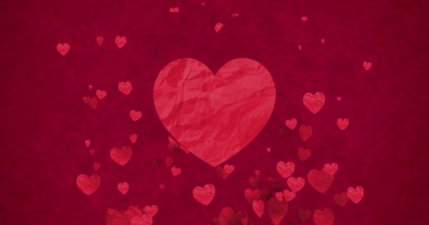 coeur bokeh rouge forme de papier froissé coulant avec un grand cœur au centre sur fond rouge avec des particules scintillent paillettes, Saint-Valentin événement de vacances d'amour  