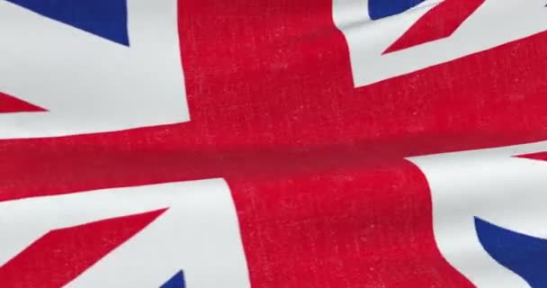 Brexit, close seup of waving flag of union jack, uk great britain england symbol, named United Kingdom flag under blue sky — стоковое видео