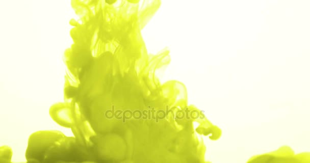 Abstract yellow ink splash splatter in water on white background — Stock Video