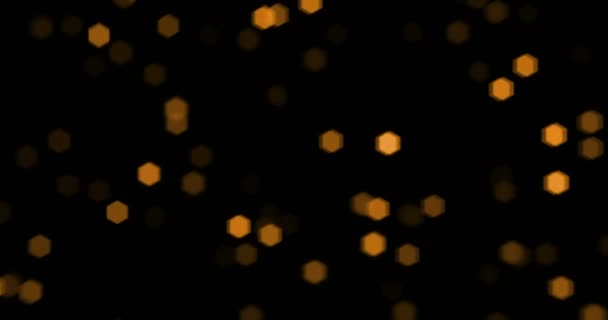 Golden karácsony részecskék tündökölj bokeh áramló a fekete háttér, arany holiday boldog új évet — Stock videók