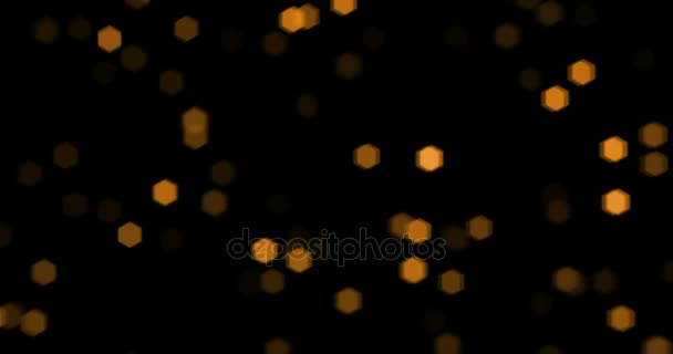 Noël particules d'or scintillent avec bokeh coulant sur fond noir, vacances d'or bonne année  