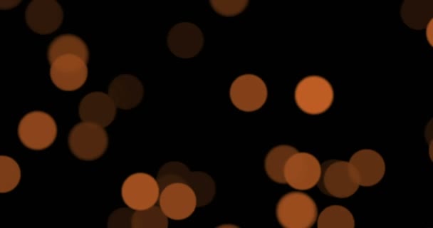 Christmas golden sparkle with bokeh flowing on black background, gold holiday happy new year — Stock Video