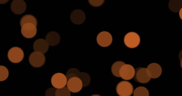 Noël éclat doré avec bokeh coulant sur fond noir, vacances d'or bonne année  