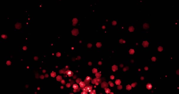 Різдвяний червоний світло блиск частинки боке петлевий зверху на чорному фоні, святкові привітання вечірка привітання з Новим роком, Різдвом, святкування дня закоханості — стокове відео