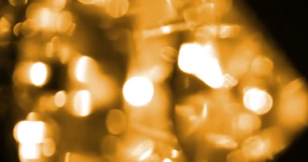 Αφηρημένη κυκλική χρυσή λάμψη glitter bokeh ροή κίνηση σε μαύρο φόντο, συγχαρητήρια πάρτι χαιρετισμού ευτυχισμένο το νέο έτος, Χριστούγεννα γιορτή — Αρχείο Βίντεο