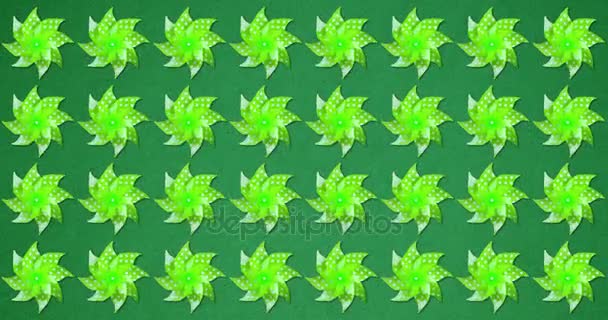 Serie van een heleboel groene catherine wielen weathercock bewegen op wind op groen schermachtergrond, concept van plezier en de onderwijs-school — Stockvideo