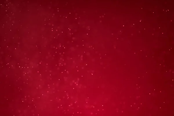 Kerst kleurovergang rode achtergrond met rode bokeh flowin abstract — Stockfoto