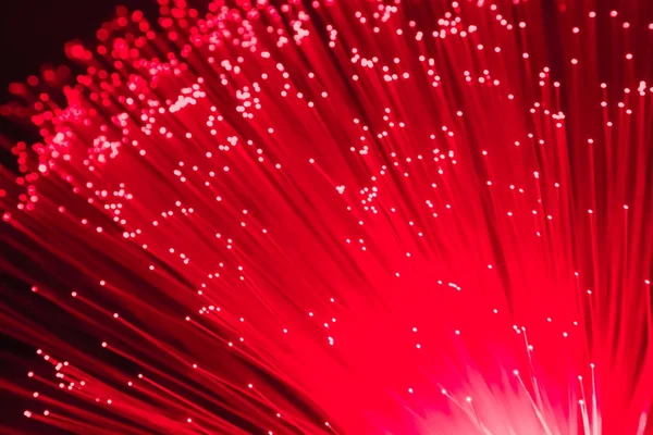 Detalhe de vermelho crescente monte de fibras ópticas de fundo, rápido l Imagem De Stock