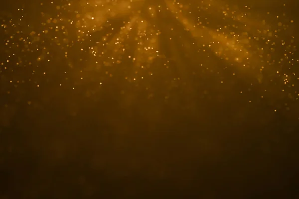 Christmas gold gradient sparkle glitter dust particles from top — Stock Photo, Image