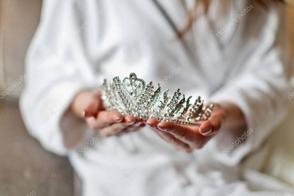 woman holding diadem