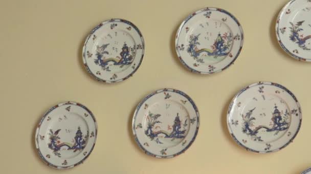 Close Porcelain Plates Hanging Wall — Stock Video