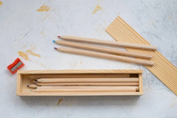 wooden pencil case with colour pencils for back to school
