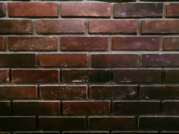 smooth wall of dark red brick. Red brick wall background.