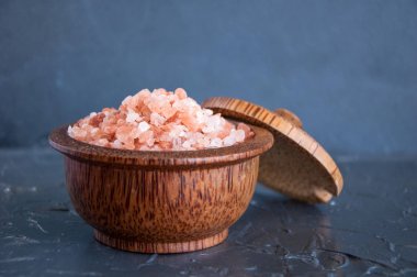 Pink Himalayan salt on a gray background clipart
