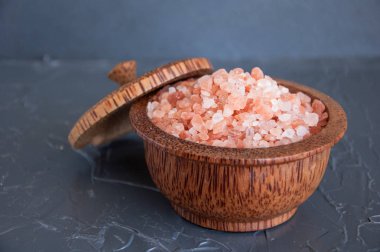 Pink Himalayan salt on a gray background clipart