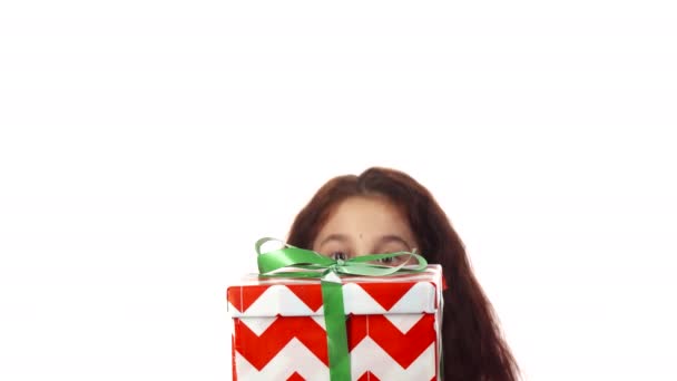 The surprised girl is delighted with her gift — Stock Video