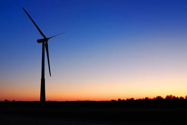 Wind turbine at sunset