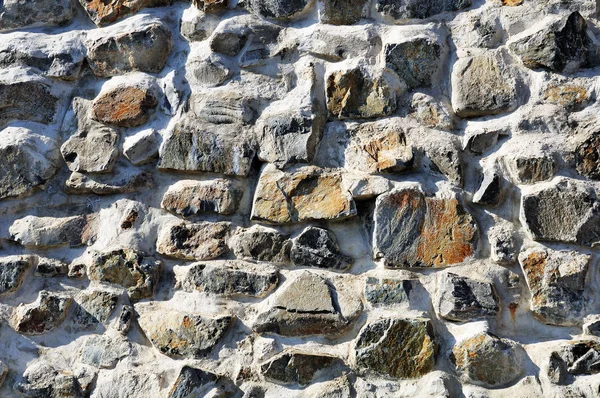 Szorstki solidny kamienny mur — Zdjęcie stockowe
