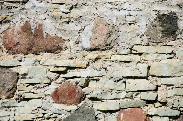 Fragmento de pared hecho de piedras irregulares ásperas — Foto de Stock