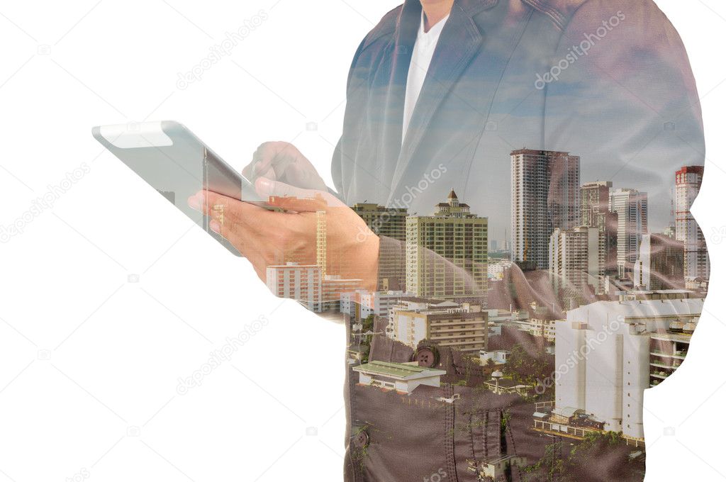 Double exposure of city and businessman on the phone as Business