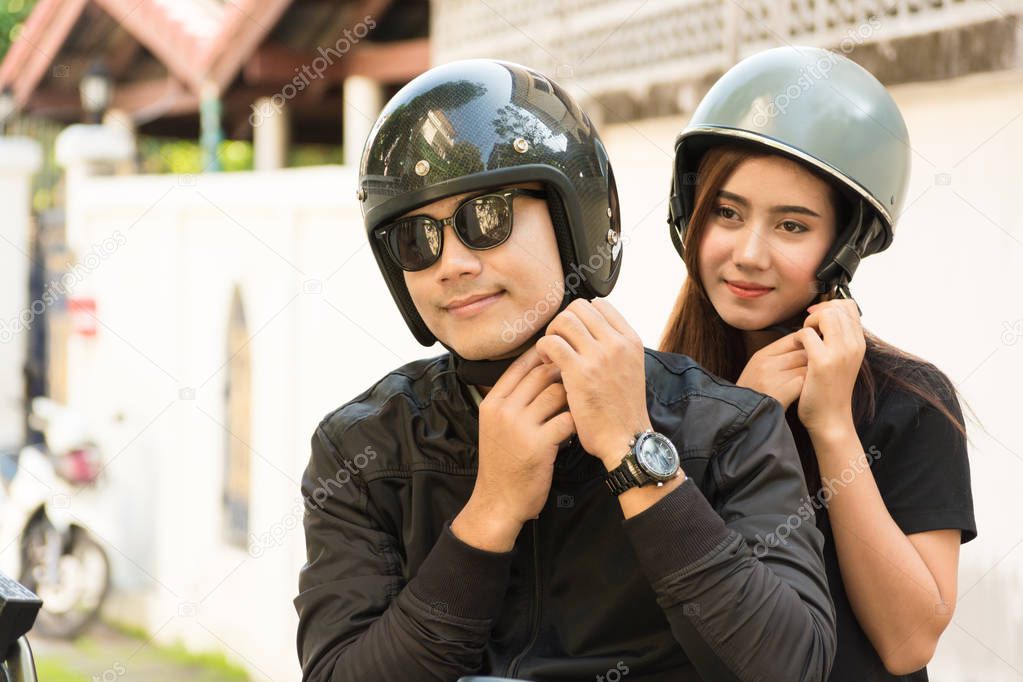 Young Adult Couple, Male and Female Biker or Motorcyclist Wearin