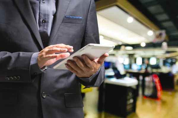 Businessman use Wireless Digital Tablet PC in Electric Appliance — Stock Photo, Image