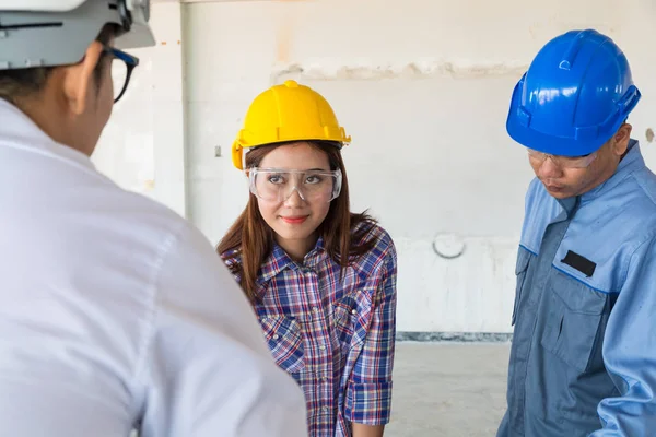 Construction team, Architect, Engineer and Foreman discussing