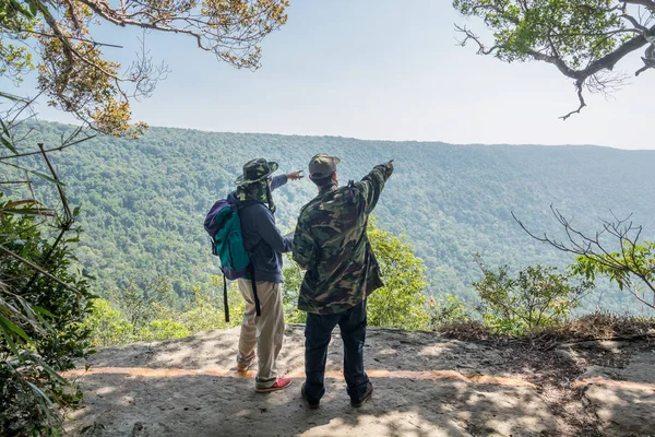 Backpacker Traveler talk with Guide or Park Ranger