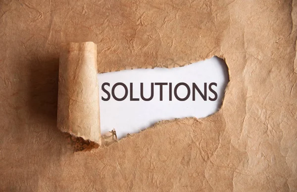 Torn paper torn uncovering solutions — Stock Photo, Image