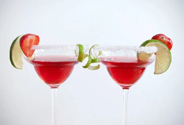 Red cocktails beverages over a white background — Stock Photo, Image