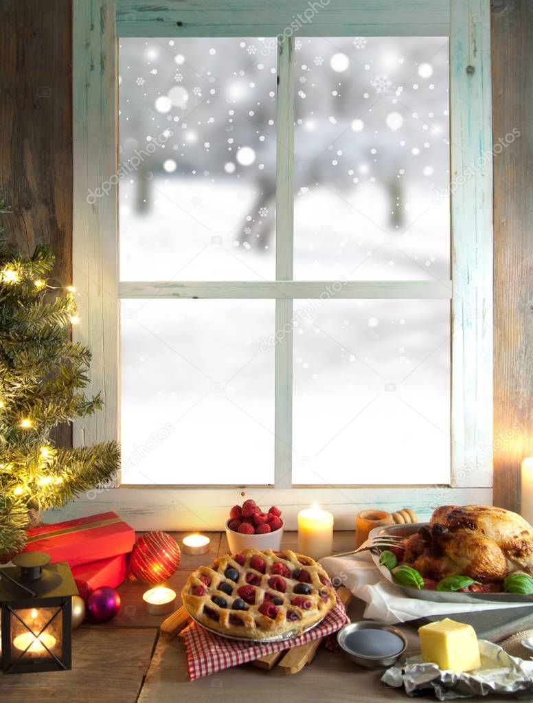Christmas window with roast meal and gifts 